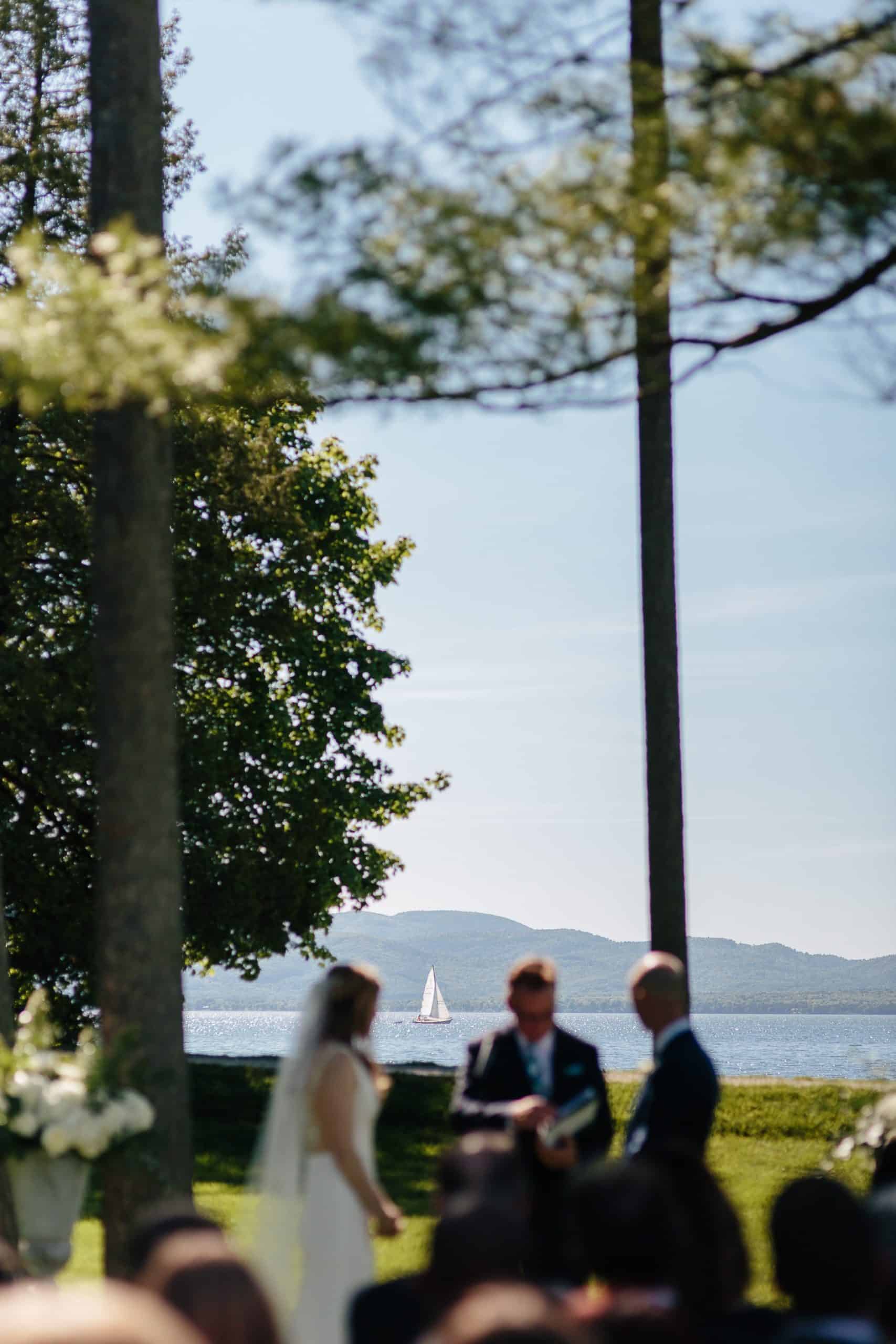 Ceremony under the pines at the Coach Barn Shelburne Farms wedding | Vermont Wedding Photographers - The Light + Color Wedding Photography