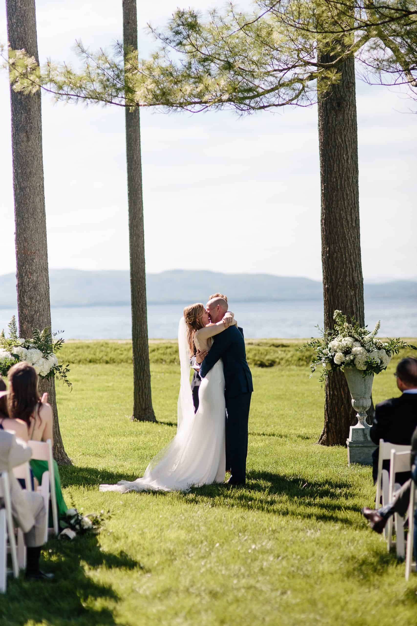 Ceremony under the pines at the Coach Barn Shelburne Farms wedding | Vermont Wedding Photographers - The Light + Color Wedding Photography