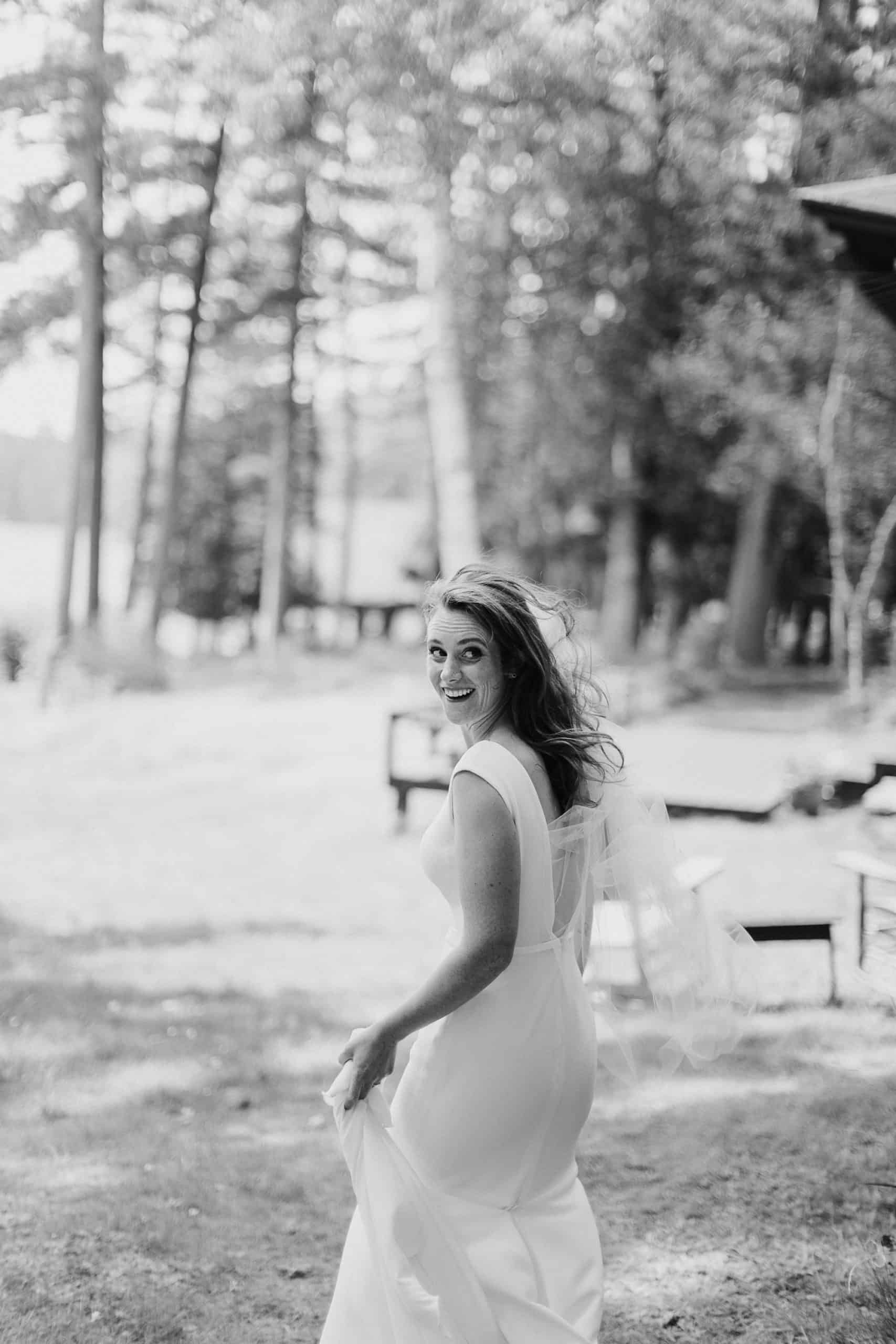 Bride walking to her first look at her Adirondack Wedding - Wedding Photographers Adirondacks - The Light + Color
