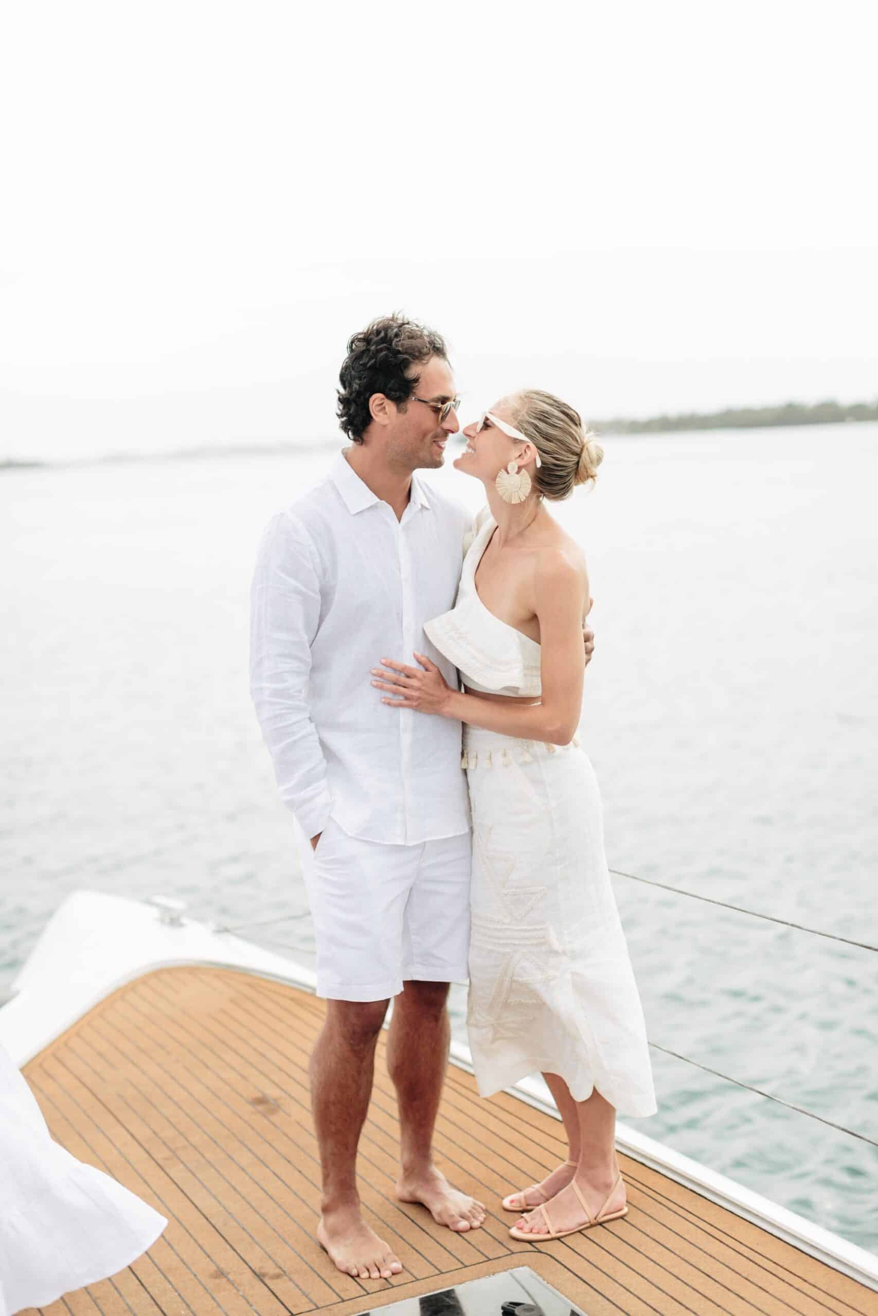 Coral beach club wedding bermuda - Bride and Groom on catamaran around Bermuda