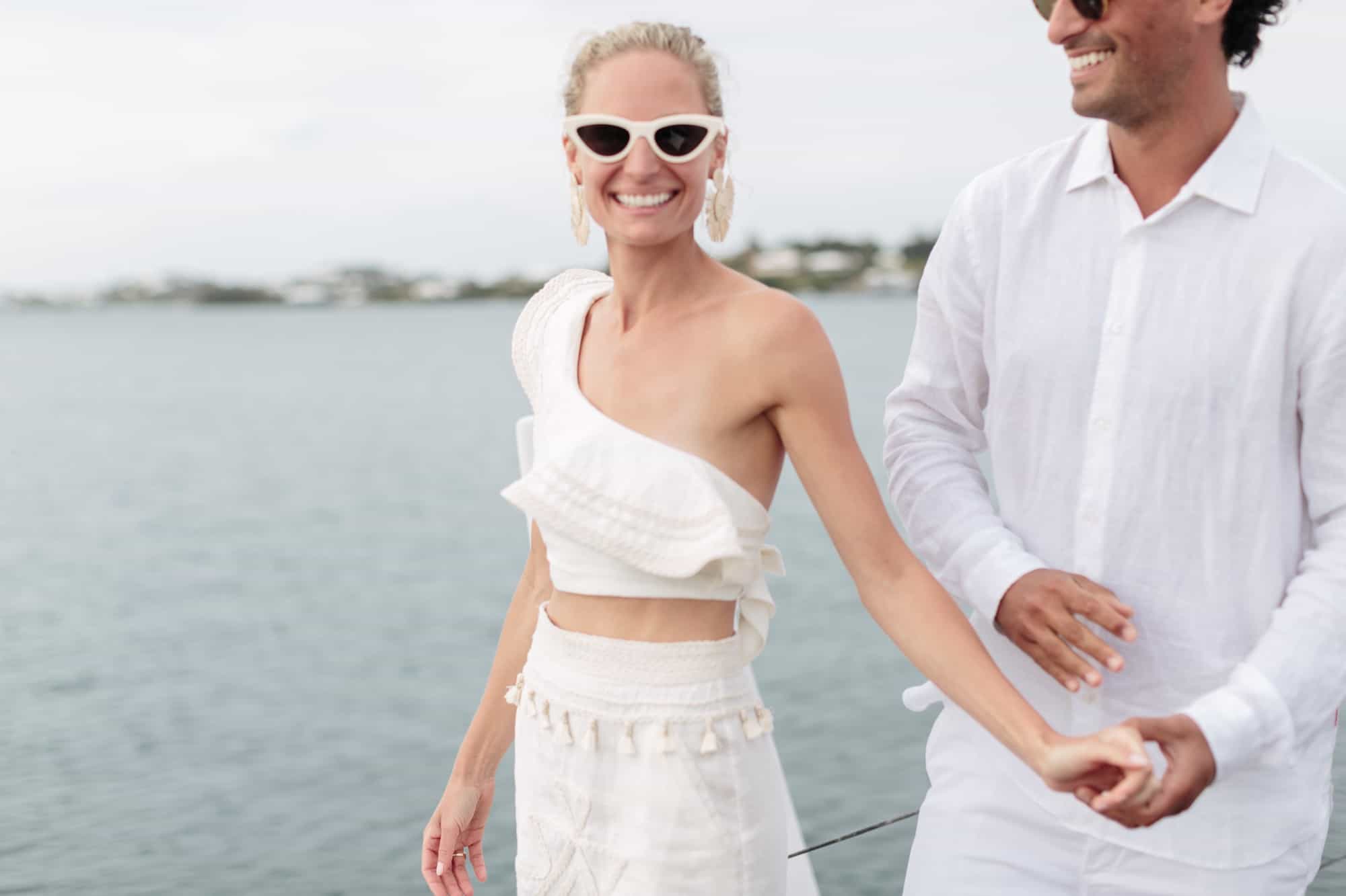 Coral beach club wedding bermuda - Bride and Groom on catamaran around Bermuda