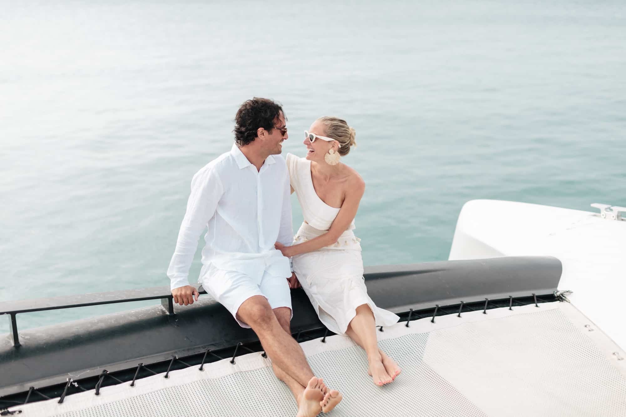 Coral beach club wedding bermuda - Bride and Groom on catamaran around Bermuda