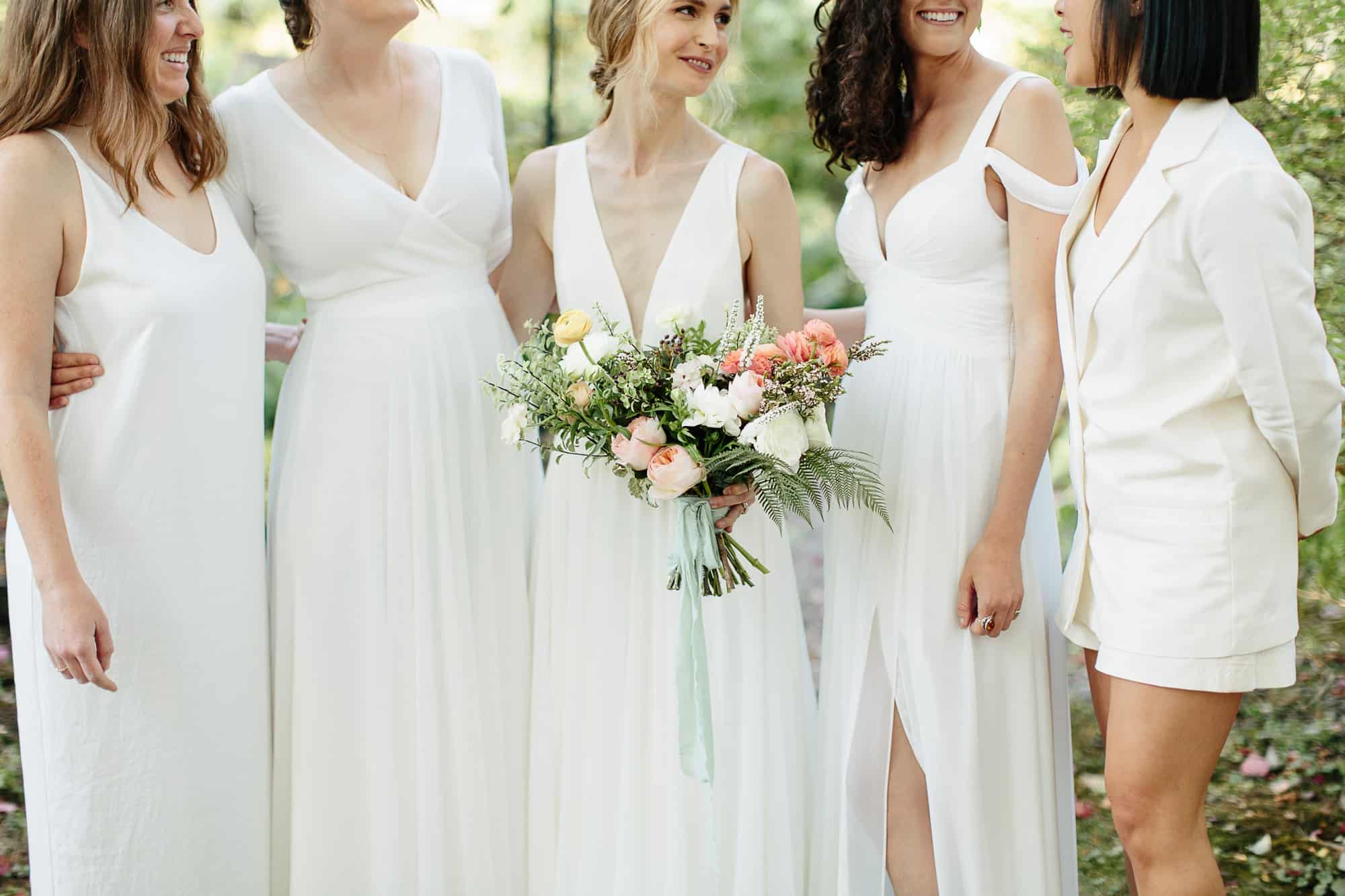 bride with her bridesmaids at their M&D farm wedding in the Catskills capture by upstate new york wedding photographers The Light and Color