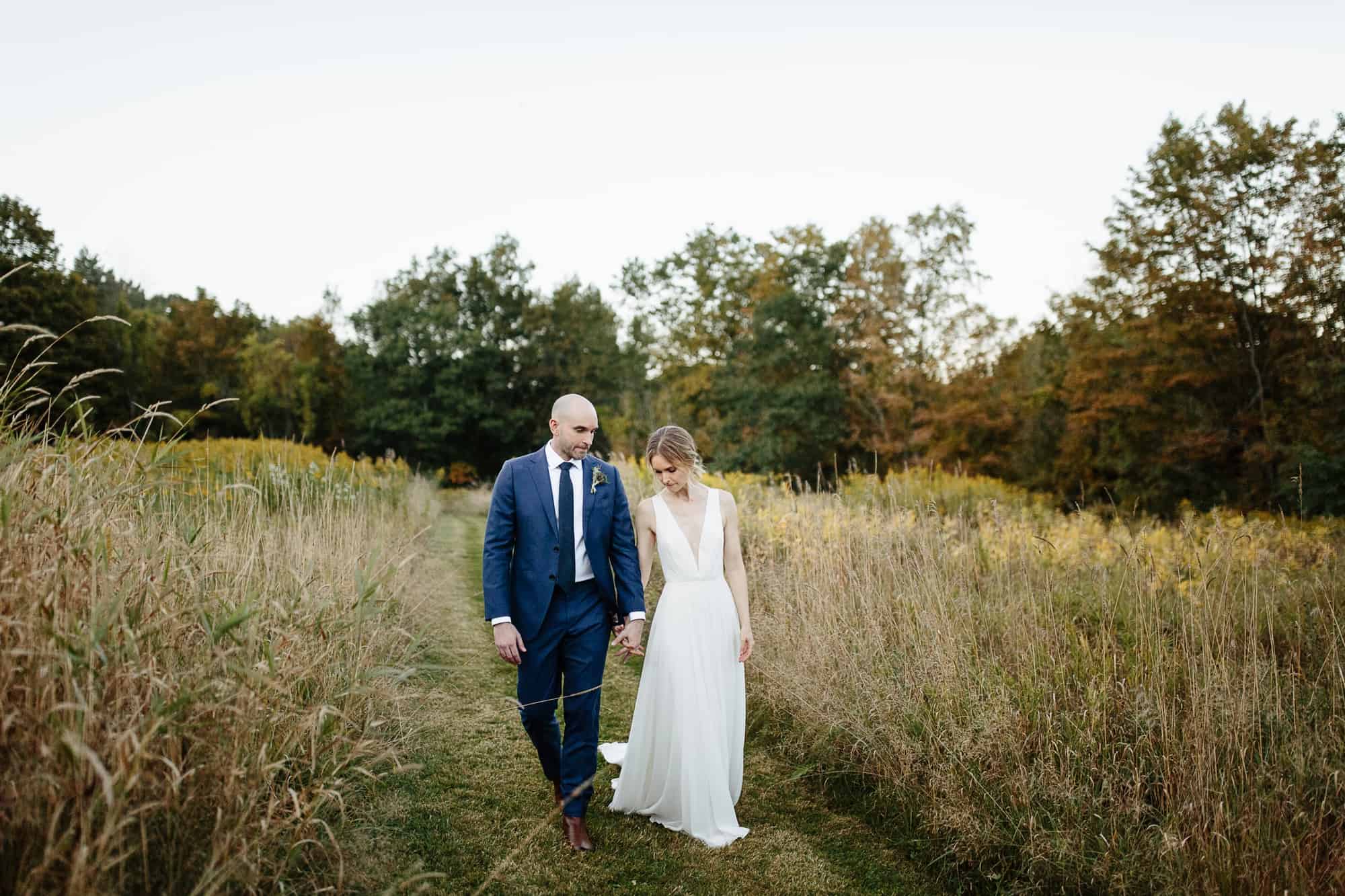 Bride and groom portraits at their M&D farm wedding in the Catskills capture by upstate new york wedding photographers The Light and Color