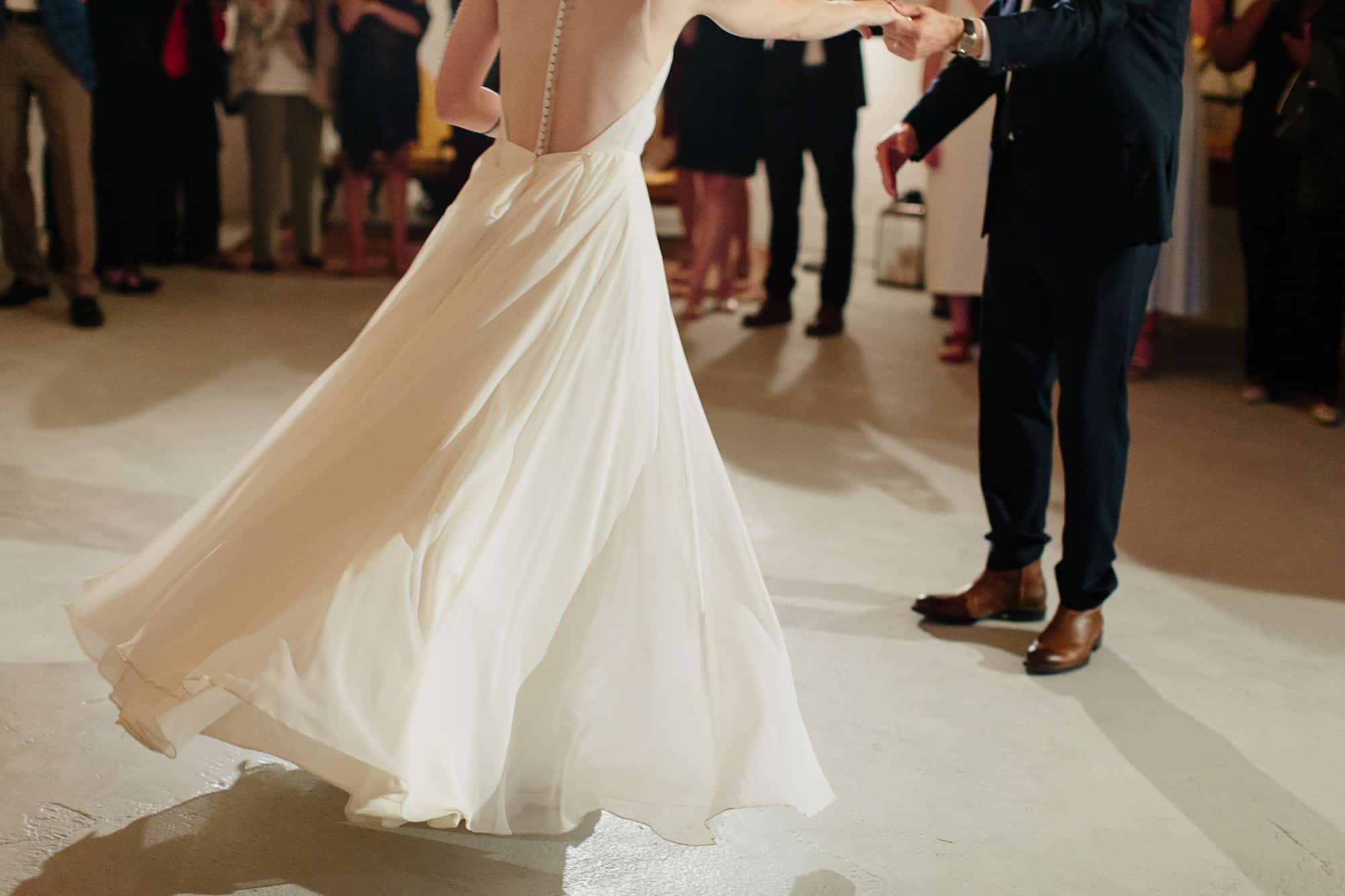 twirling jenny yoo dress during first dance at M&D farm wedding capture by Catskills wedding photographers The Light and Color