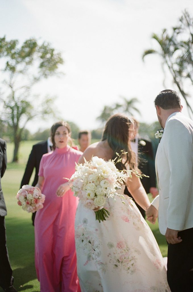 Bride and Groom with bridal party take portraits at Gulfstream Club wedding