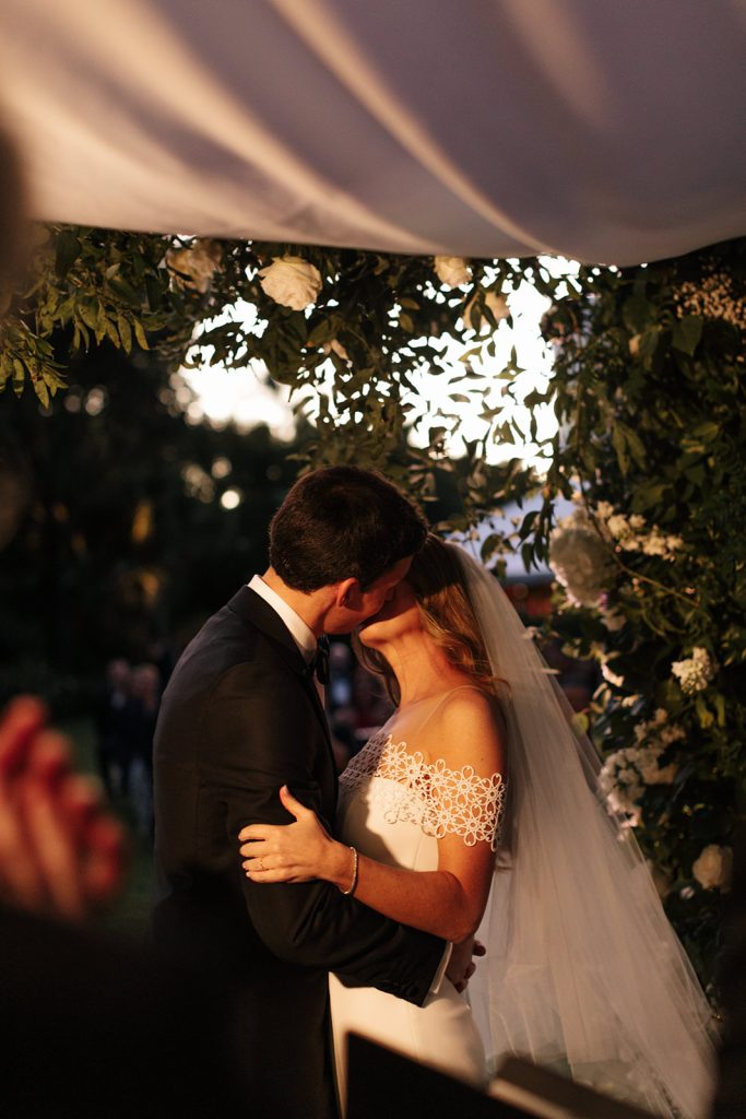 Bride and groom under chuppah at wedding ceremony at Norton Museum wedding
