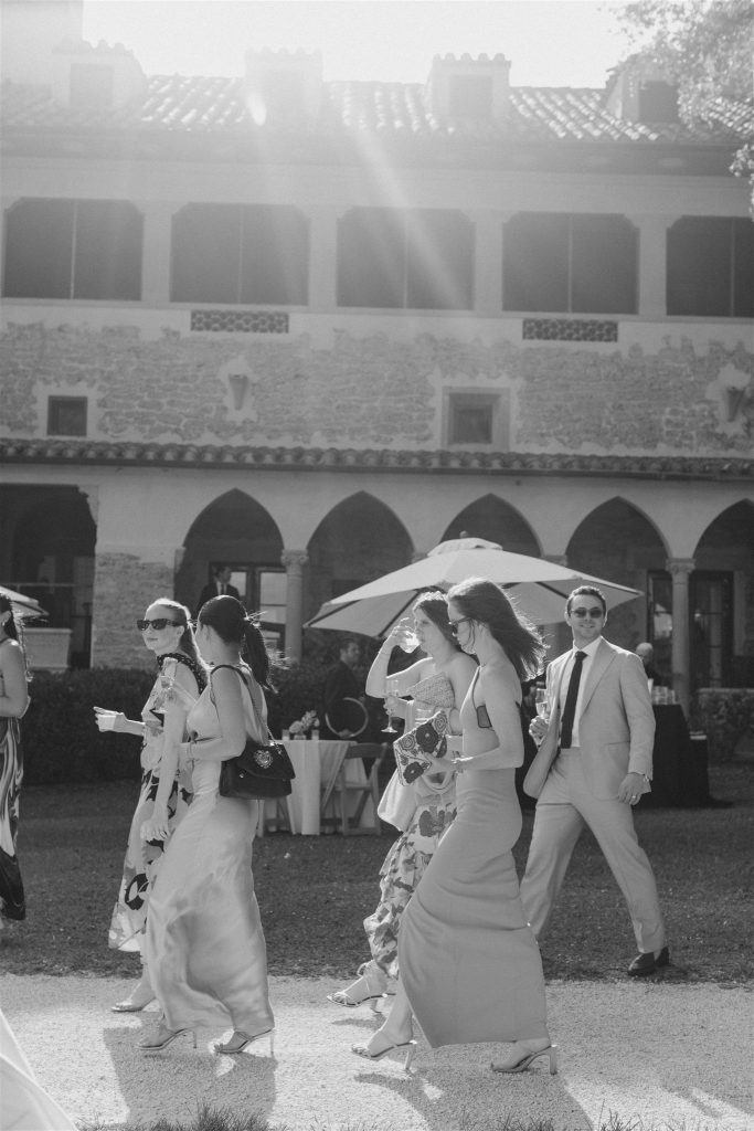 Guests going form ceremony to cocktail hour at Deering estate wedding